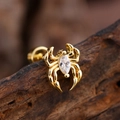 Macro shot of gold spider stud earring with marquise zircon on a natural wood surface - Marquise Zirconia Spider Style (3137) / Gold