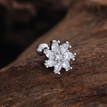 Macro detail of silver flower labret stud with marquise-cut zircon petals on dark wood - Flower Cluster Style (3436) / Silver