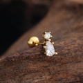 Macro view of gold ear stud featuring round and waterdrop cubic zirconia stones - Pear Double Zircon Style (3437) / Gold