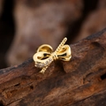 Macro shot of gold bow stud earring with micro-pave cubic zirconia on wood background - Bow with One Side Zirconia Style (3142) / Gold