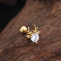 Macro detail of gold reindeer cartilage stud with cubic zirconia on wood background - Reindeer Shape (3439) / Gold