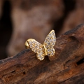 Macro shot of gold butterfly stud earring with pave-set cubic zirconia on wood - Pave Butterfly Style (3148) / Gold