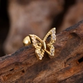Macro detail of a golden butterfly ear stud featuring cubic zirconia micro-inlay accents - Pave Butterfly Style (3150) / Gold