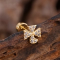 Macro shot of gold cross ear stud with micro-pave zircons on a rustic wood surface - Pave Cross Style (3151) / Gold