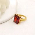 Detail shot of a 18K gold plated titanium ring with a rectangular red gemstone inlay - Size 7 / Red Zirconia