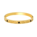 Detail of 18K gold plated bangle featuring S-pattern engravings and black stone insets - Bangle / Green Zirconia Style (YS878)