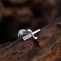 Silver sword helix stud earring with cubic zirconia on rustic wood background - Sword Style (3382) / Silver