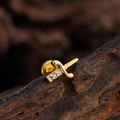 Exquisite gold sword stud earring with micro-set zircons on a wooden texture background - Sword Style (3382) / Gold
