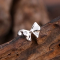 Minimalist silver bow-shaped cartilage stud earring with cubic zirconia on wood - Double Zirconia Bow Style (3149) / Silver