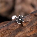 Minimalist black zircon flower stud earring with silver base on rustic wood background - Black Zirconia Four Petal Flower Style (3139) / Silver