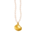 Detailed close-up of a 18K gold shell pendant on a natural pearl necklace - Shell Style (CK655)