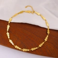 Detail of golden fishbone chain necklace with lobster clasp on silk and wood - Fishbone Necklace (CK806) / Gold