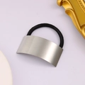 Detail of silver brushed metal curved plate hair tie with strong elastic rope - Long Style / Silver