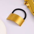 Detail of golden brushed rectangular metal buckle on a black elastic hair tie - Long Style / Gold
