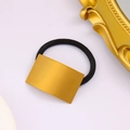 Detail of high-elastic black hair tie with a minimalist brushed gold rectangular ornament - Short Style / Gold