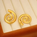 Chic golden spiral conch stud earrings in stainless steel on a beige velvet jewelry display - Artistic Spiral Style (CK269)