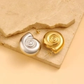 Two-tone snail shell spiral earrings in gold and silver finish on stone background - Gold and Silver Bicolor Snail Style (CK127)