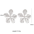 Detailed view of silver 40mm five-petal floral earrings with hammered metal texture - Hammered Five-Petal Flower (CK2) / Silver