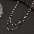 Detail of silver double-layer necklace featuring a sleek snake chain and beaded link style - Double Layer Snake Bead Chain Style(CK812-Steel) / Silver