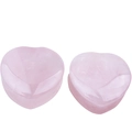 Macro detail of heart-shaped pink quartz ear plugs with polished stone texture - 12mm Rose Quartz