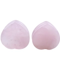 Detailed view of heart-shaped natural rose quartz ear plugs with smooth polished finish - 16mm Rose Quartz