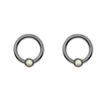 Detailed macro view of black plated stainless steel rings with white opal inlay - Opal Black