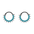 Detail of black stainless steel nose rings with blue beads and clear crystals set in waves - Turquoise Black