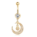 Close-up of golden belly button ring with moon and star zircon pendant details - Gold