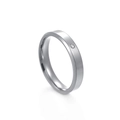 Macro view of matte brushed stainless steel ring with a single inset zircon stone - US 6 / Female Style / Silver