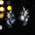 Sparkling zircon flower earrings featuring blue pear-cut stones in a luxury design - Gold and Deep Blue Pear Style
