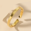 Close-up of minimalist gold-plated cuff bracelet with polished finish on warm beige background - Adjustable Open / Gold 2mm