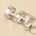 Three minimalist silver open rings in varying widths on a neutral beige background - Adjustable Open / Silver 3-Piece Set