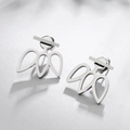 Detailed view of polished geometric floral stud earrings in high-grade stainless steel - Steel