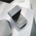 Macro shot of a grey velvet jewelry gift box showing open and closed flip-top states - Velvet Ring Box / Gray