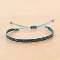Detail of blue geometric woven bracelet featuring an adjustable drawstring and metal beads - Dark Blue Light Blue Geometric (KZ-0014O)