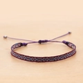 Macro detail of handmade ethnic woven bracelet with burgundy geometric patterns and bead ties - Wine Red Blue White Geometric (KZ-0014P)