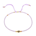 Dettaglio del braccialetto in perline Miyuki con pietre naturali e cordino lilla regolabile - Mix Viola Chiaro Oro con Pietra Metallica (BR0130)