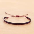 Detailed view of handmade woven bohemian wristband with red and black herringbone pattern - Red Black Herringbone (KZ-0014R)