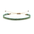Detail view of Bohemian hand-woven bracelet featuring colorful geometric diamond patterns - Green Yellow Blue White Rhombus (KZ-0014L)