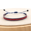 Detail of handmade woven bracelet featuring blue red and grey geometric patterns - Gray Red Blue Rhombus (KZ-0012B)