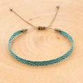 Detail of hand-woven bohemian bracelet with V-pattern and adjustable sliding knot - Teal Gray V-Wave Style (KZ-0041)