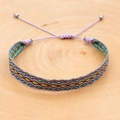 Macro detail of Bohemian embroidered woven bracelet with geometric patterns on wood - Dark Gray Orange Yellow Green Rhombus Style (KZ-0040)