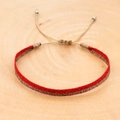 Macro shot of handmade red and gold woven bohemian bracelet on a natural wood surface - Red Gold Dual Color Style (KZ-0035)