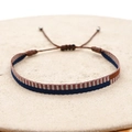 Detailed macro view of Bohemian handwoven fabric bracelet with adjustable cord and beads - Deep Blue Brown White Spliced Style (KZ-0034)