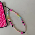 Detailed close-up of rainbow bead phone lanyard with evil eye and smiley charms - Colorful Flower Style (SZ-A220005A)