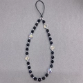 Detail of beaded phone strap with black faceted beads and clear clover crystal - Sj-a220004a