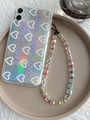 Close-up of holographic iPhone case with purple LOVE text and colorful crystal bead strap - Rainbow Cube Beaded Style (SJ-A220015A)