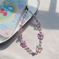 Elegant beaded phone strap with lavender butterfly charm and pastel beads in a ceramic tray - Lavender Butterfly & Pink Matte Bead Style (SJ-A230006A)