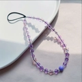 Purple beaded phone strap with crystal butterfly accents on a white porcelain dish - Purple Butterfly Beaded Style (SJ-A230008A)
