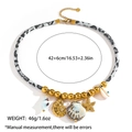 Detailopname van de boheemse zeester schelpen en luipaardprint koord aan de ketting - Evil Eye Wulk Zeester Stijl (DKN254023GL)